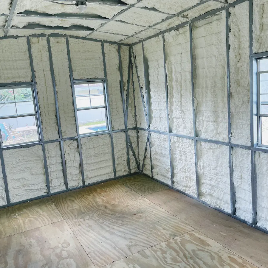 Closed-cell spray foam insulation applied to wall cavities in a residential project in Bridgton